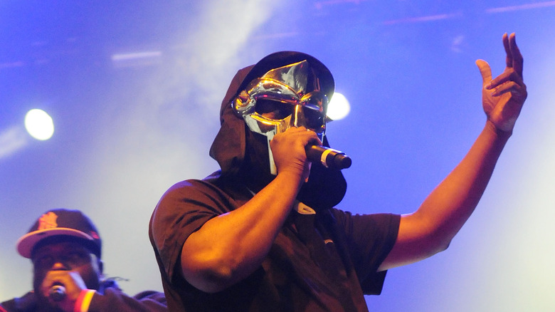 MF DOOM wearing black and sliver