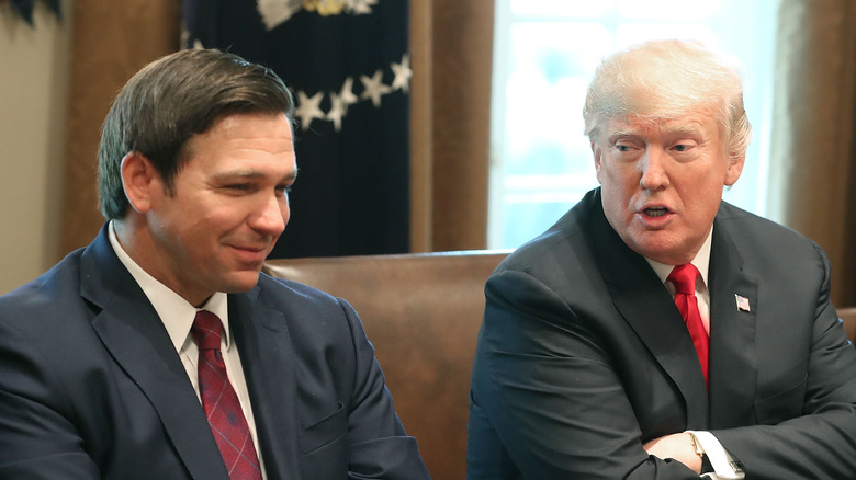 Ron DeSantis and Donald Trump in a meeting