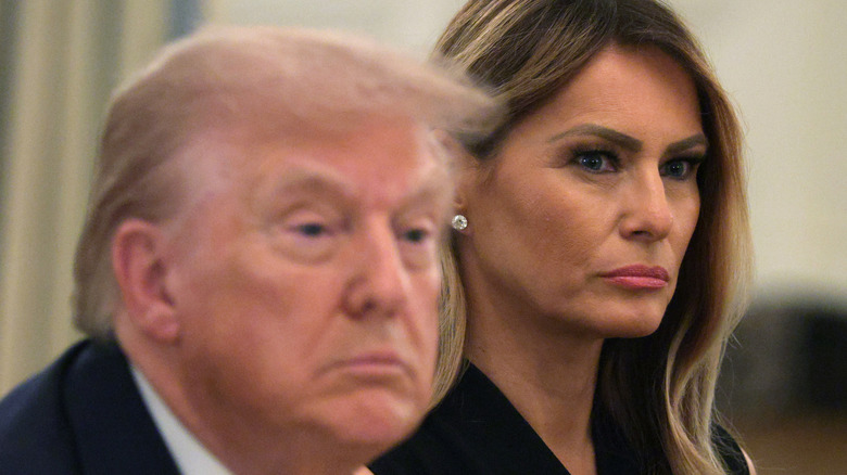 Donald Trump sitting with Melania Trump