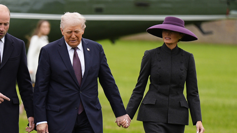 Donald Trump and Melania Trump holding hands during their UK visit
