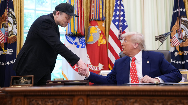Elon Musk and Donald Trump shaking hands