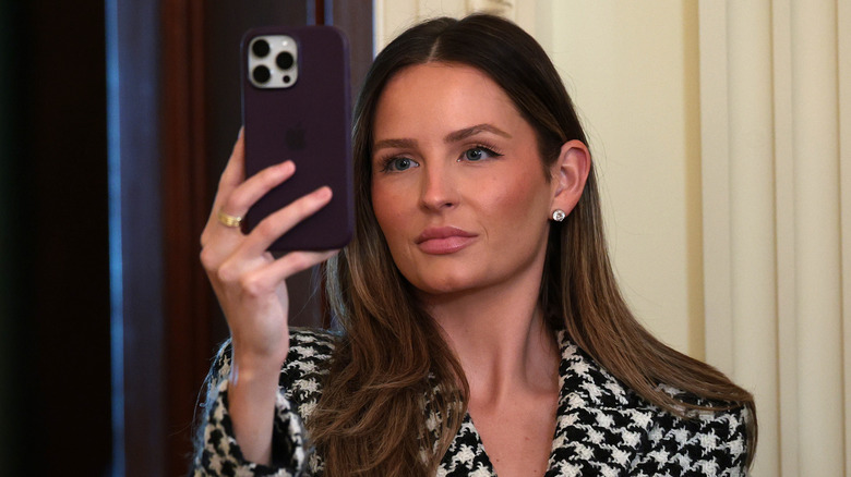 Margo Martin holding up phone in right hand