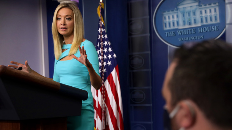 Former White House press secretary Kayleigh McEnany at podium in blue dress