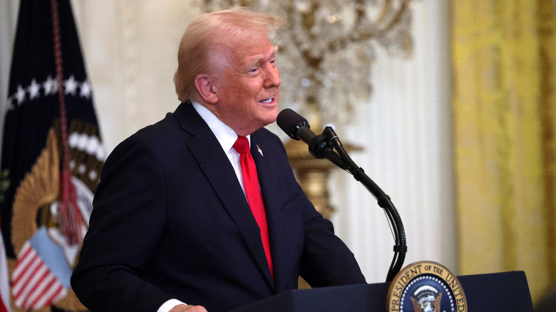 President Donald Trump speaking during a Women's History Month event in the East Room of the White House