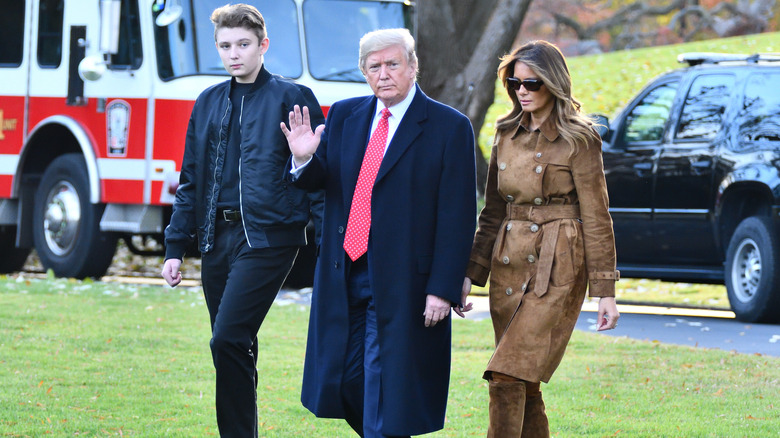 Barron, Donald, and Melania Trump walking