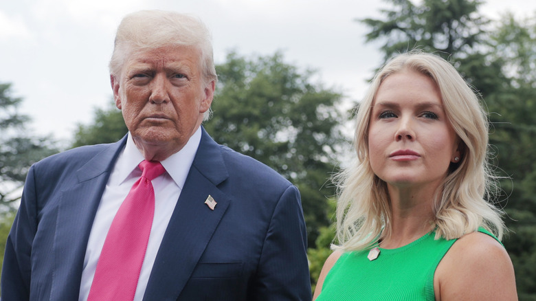 Donald Trump fielding questions next to Karoline Leavitt