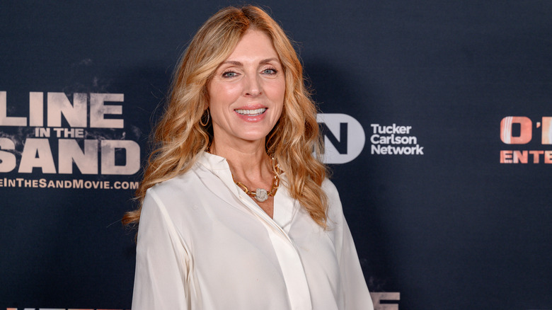 Marla Maples smiles at a movie premiere