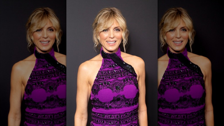Marla Maples wears a purple sleeveless dress