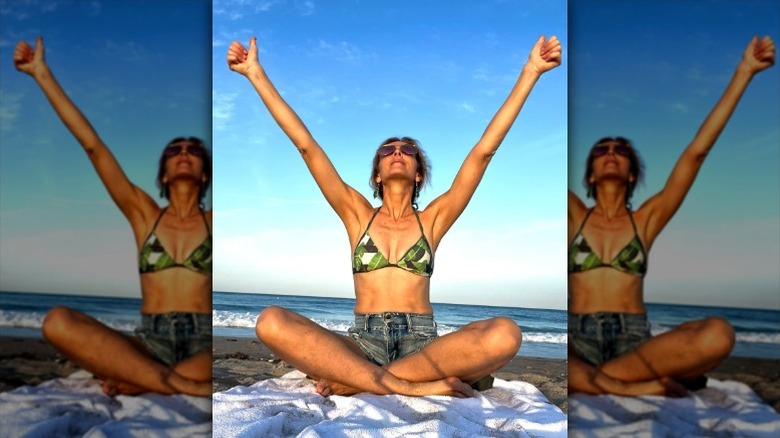 Marla Maples practices breathing exercises on the beach