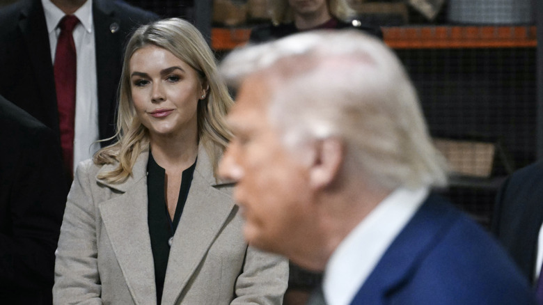 Karoline Leavitt staring at Donald Trump