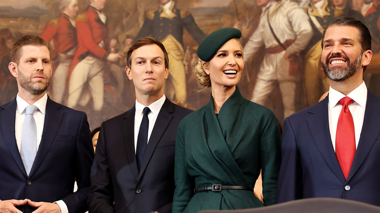 Eric Trump, Jared Kushner, and Donald Trump Jr. all wearing suits while Ivanka Trump is in a green dress and hat.