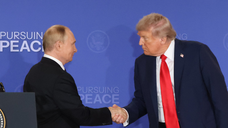 Donald Trump shaking hands with Vladimir Putin