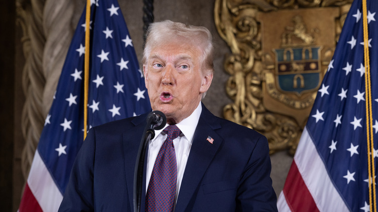 Donald Trump speaking to members of the media during a press conference at the Mar-a-Lago Club