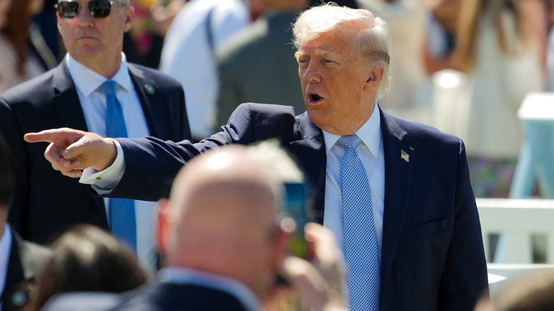 Donald Trump pointing to someone off camera at the 2026 Easter Egg Roll