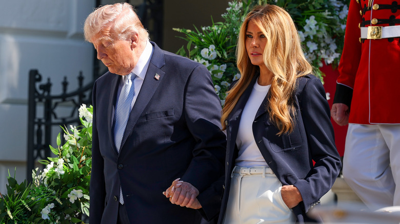 Donald and Melania Trump walking hand-in-hand at the 2026 Easter Egg Roll