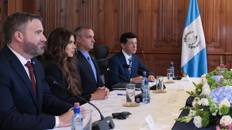 Kristi Noem and Corey Lewandowski sit together during meeting with Guatemalan president in June 2025