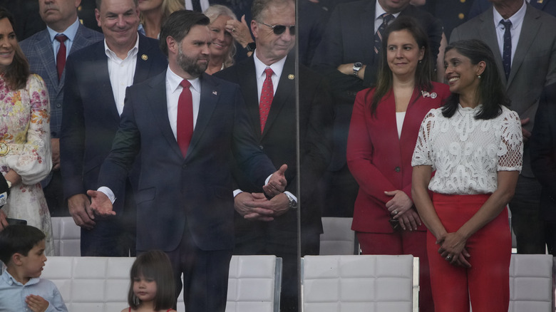 JD Vance looking at his wife with his arms spread