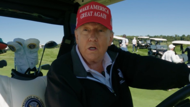 Donald Trump seen in a golf cart in one of his granddaughters' YouTube videos.