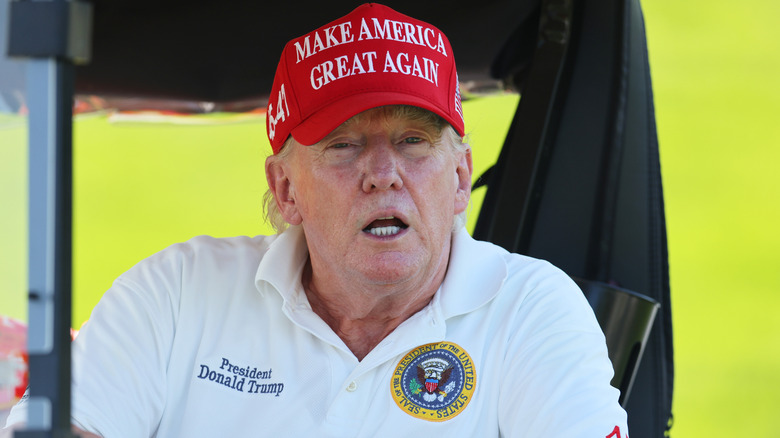 Donald Trump in full Trump regalia at the 2023 LIV Golf  invitational.