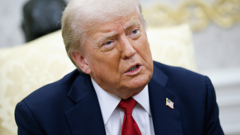 Donald Trump having a conversation in the oval office