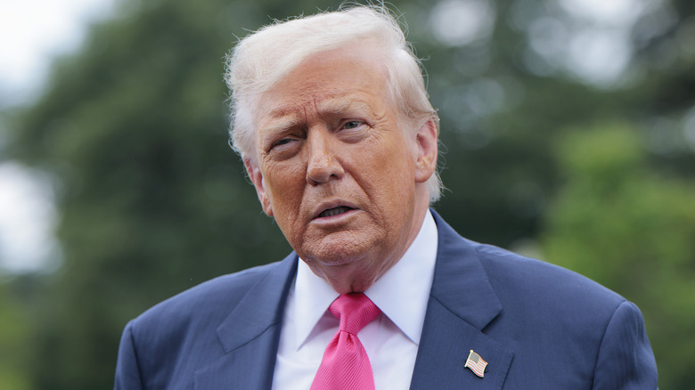 Donald Trump with a serious expression on his face.