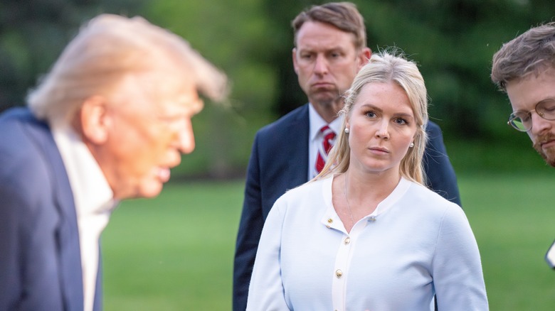 Karolinbe Leavitt looking at Trump talking