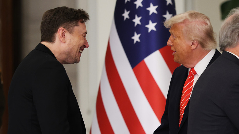 Elon Musk and Donald Trump shaking hands