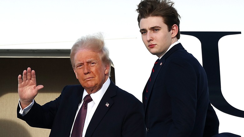 Donald Trump and Barron Trump board a plane in West Palm Beach, FL (2025)