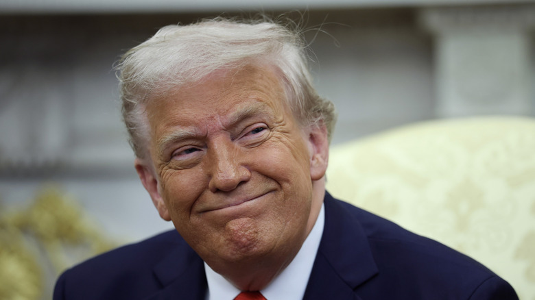 President Donald Trump smiling as he meets with President Nayib Bukele of El Salvador in the Oval Office of the White House