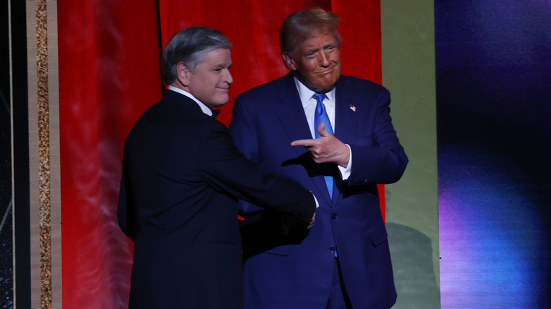 Sean Hannity presents an award to U.S. President-elect Donald Trump during the FOX Nation's Patriot Awards at the Tilles Center