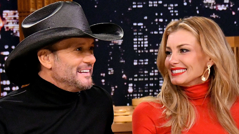 Tim McGraw and Faith Hill smiling and talking on "The Tonight Show with Jimmy Fallon"
