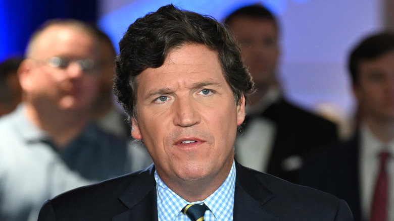 Tucker Carlson black suit