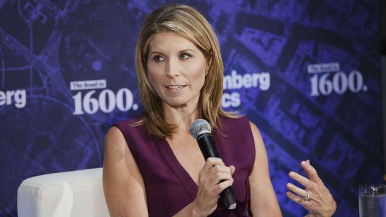 Nicole Wallace holding microphone