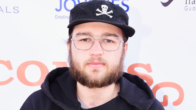 Angus T. Jones posing at an event