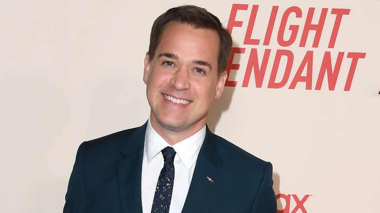 T.R. Knight posing at an event