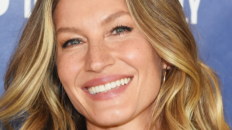 Gisele Bündchen smiling for photo