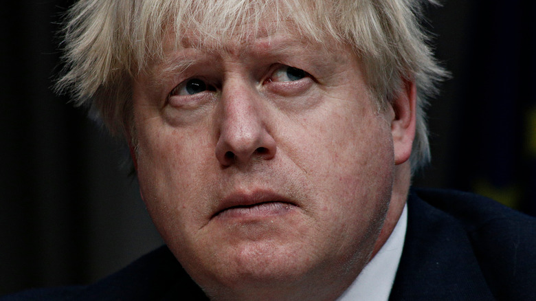 Boris Johnson looks somber