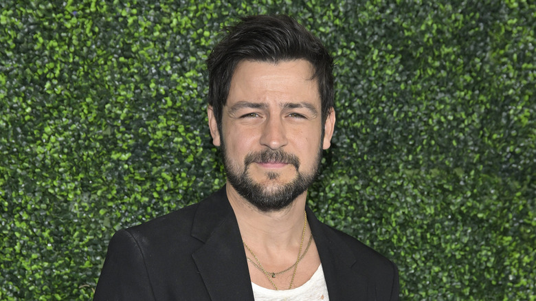 Tyler Hynes poses at a 2022 Hallmark event