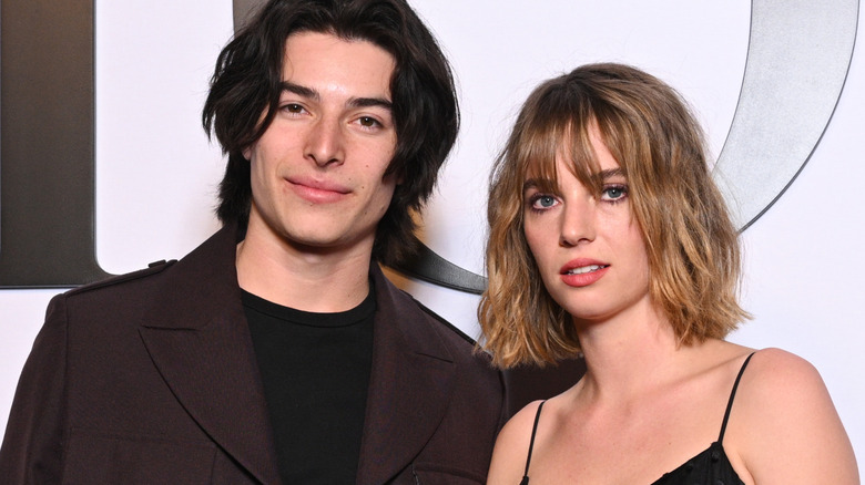 Spencer Barnett and Maya Hawke attend a Dior show at Paris Fashion Week in 2022