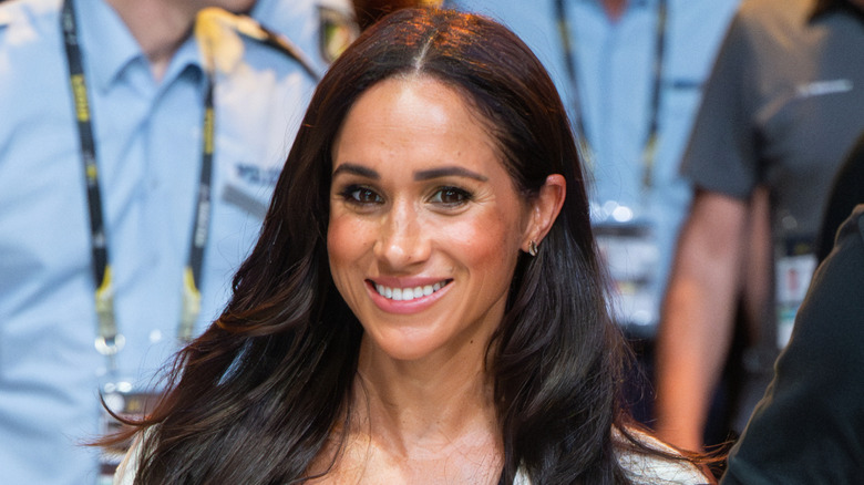 Meghan Markle smiling at an event