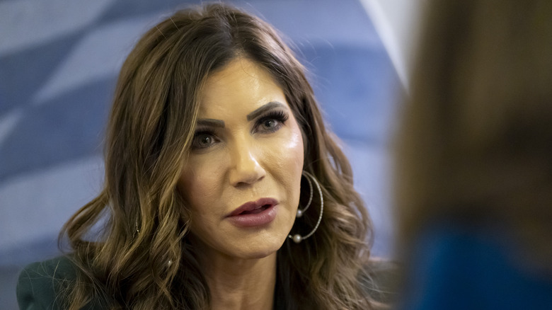 Kristi Noem speaking to a reporter