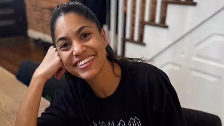 Alexis Lewis posing at a table