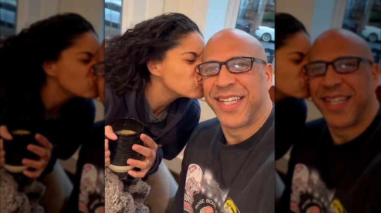 Alexis Lewis kissing Cory Booker's cheek