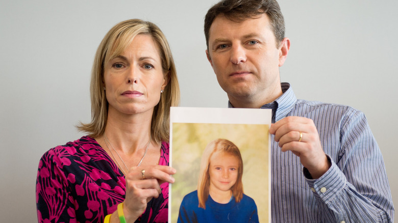 Kate McCann Gerry McCann holding composite image of older Madeleine McCann
