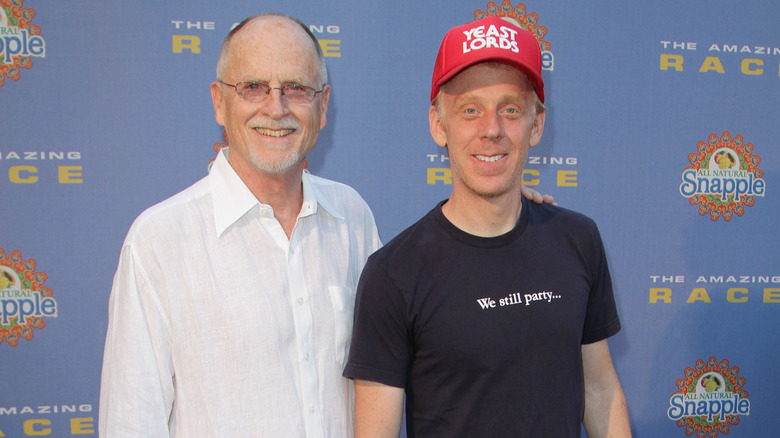 Mike White posing and smiling with his father, Mel White