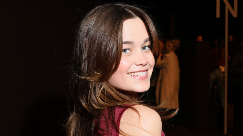 Sarah Catherine Hook smiling with people in the background