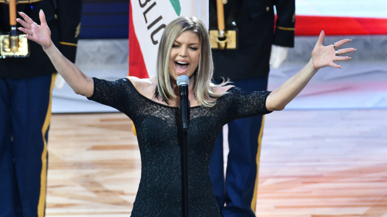 Fergie gesturing wildly while singing