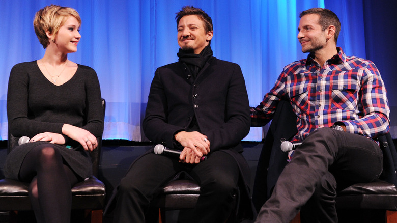 Jennifer Lawrence, Jeremy Renner, and Bradley Cooper on stage