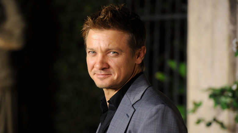 Jeremy Renner smirking