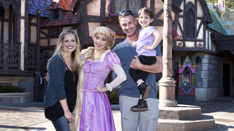 Sarah Michelle Gellar and Freddie Prinze Jr. at Disneyland with daughter Charlotte